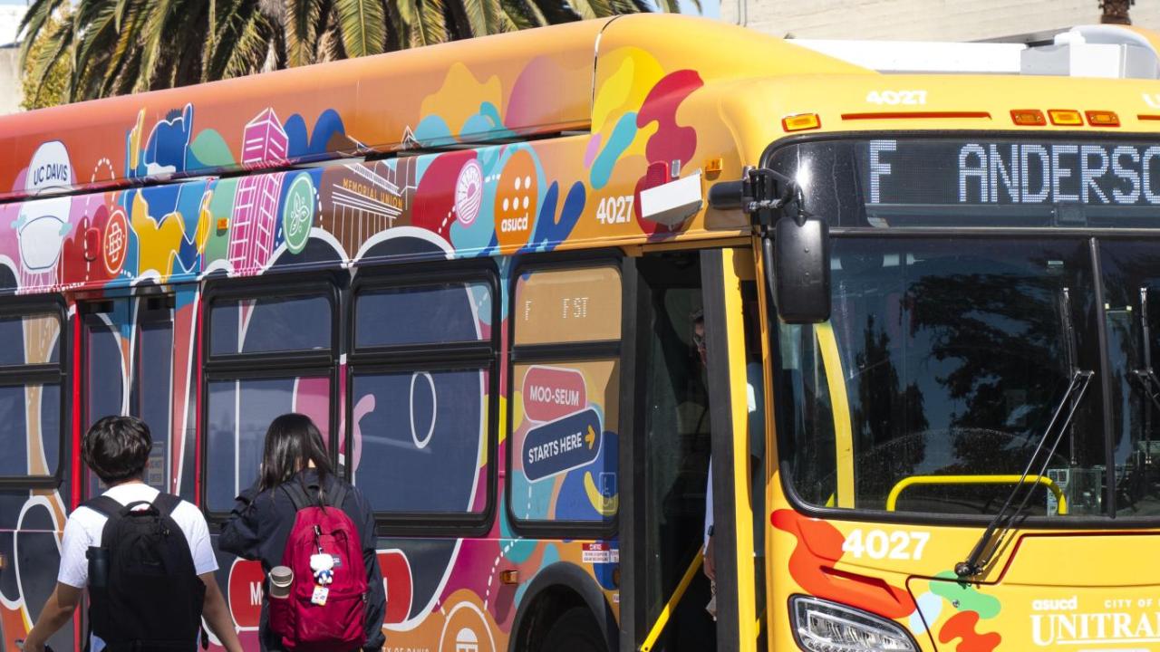 The "Moo-vin' Moo-seum" (Moving Museum) Bus, which is a Unitrans bus decorated to be a gallery space.